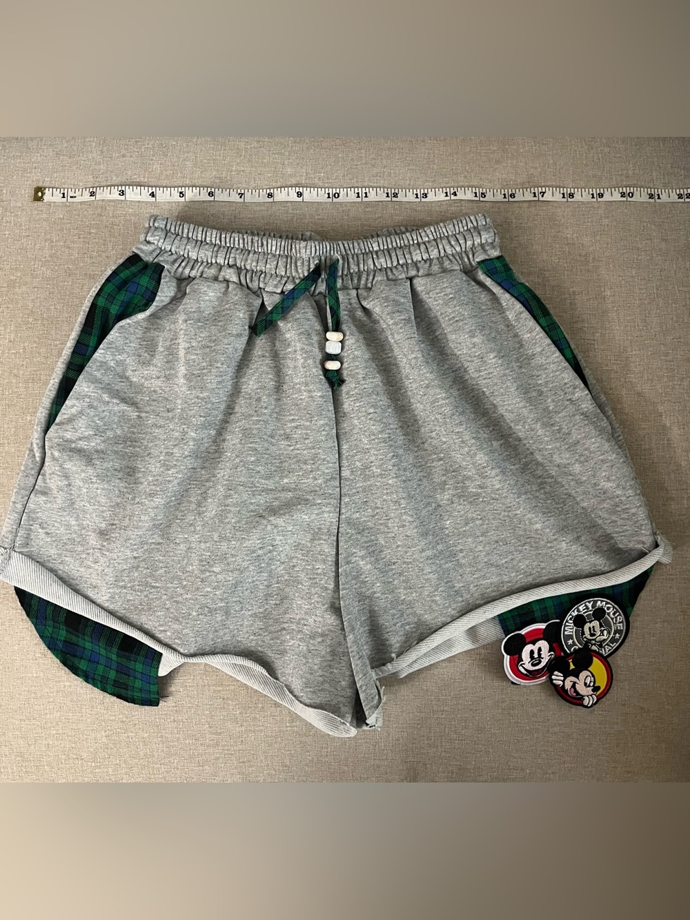 Grey shorts with green/blue side panels & Mickey Mouse appliqués